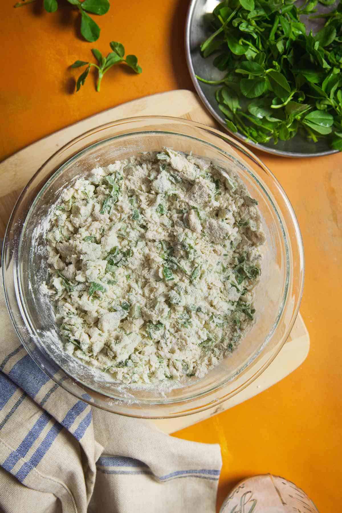 Mixing dry nad wet ingredients for naan dough.