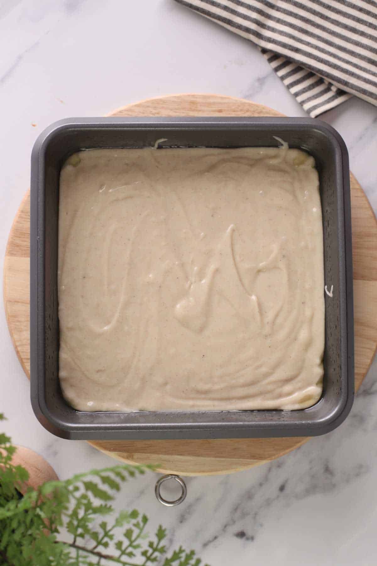  Eggless cake batter in a cake pan. 