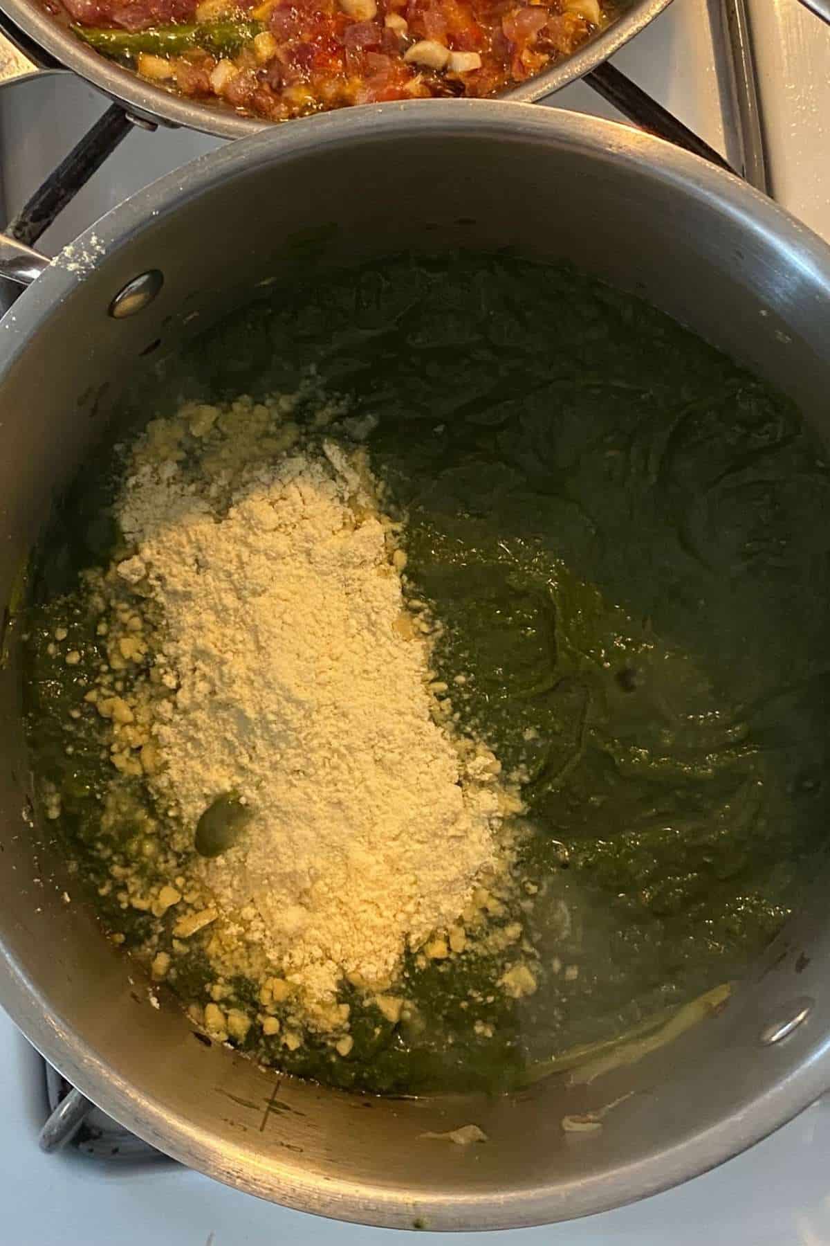 Add dry roasted makki atta to the saag and mix well.