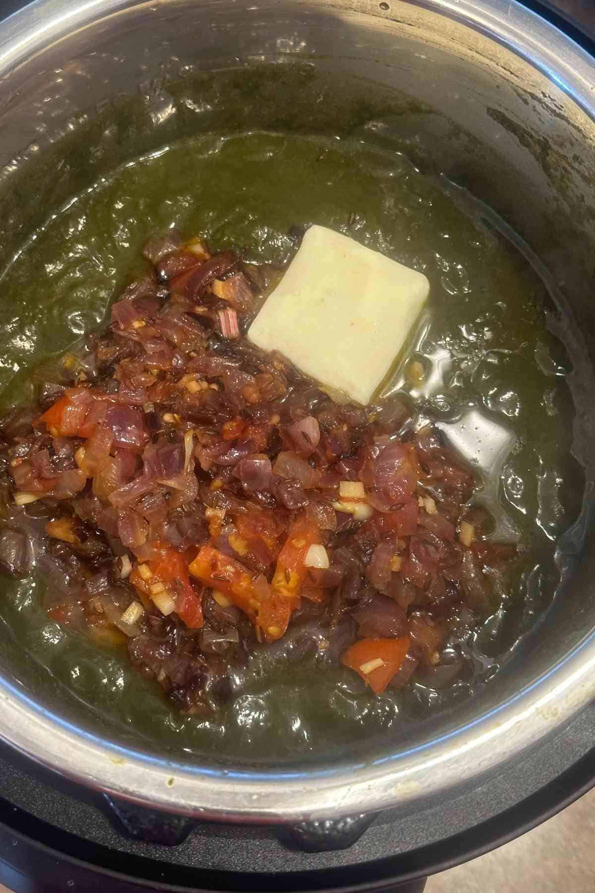 Sarson saag finished with onion tomato tadka and knob of butter.