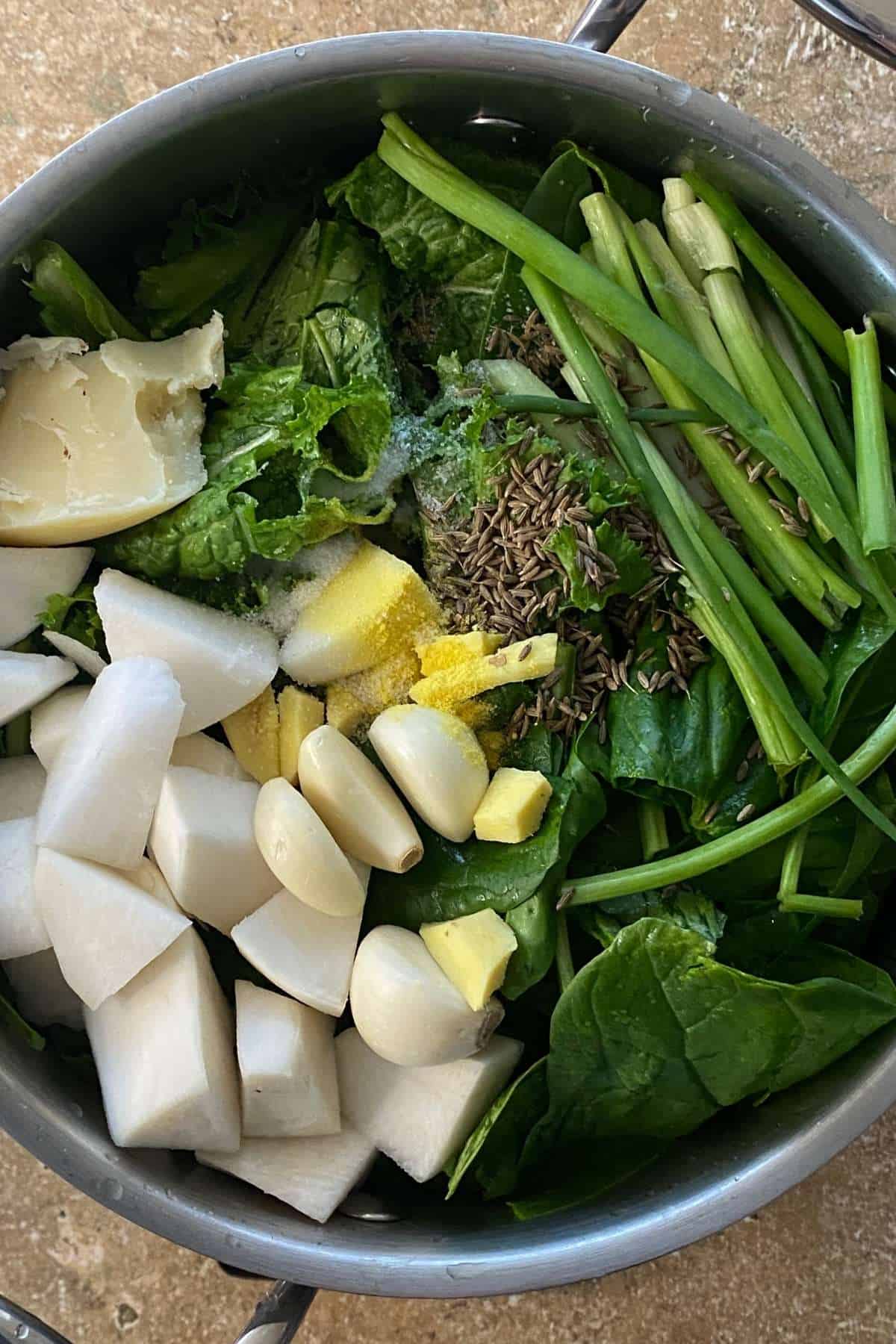 Boil sarson saag on low heat.