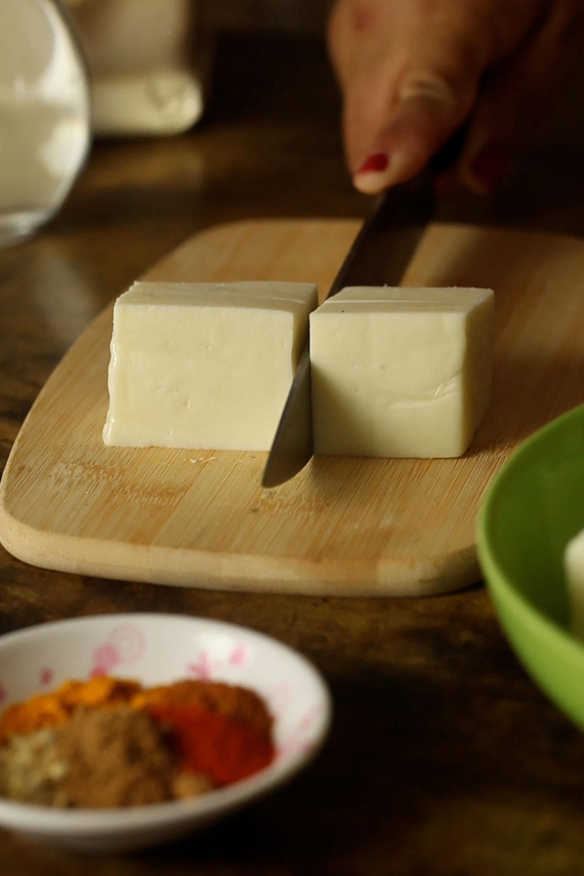 A log of paneer is cut into smaller cubes.