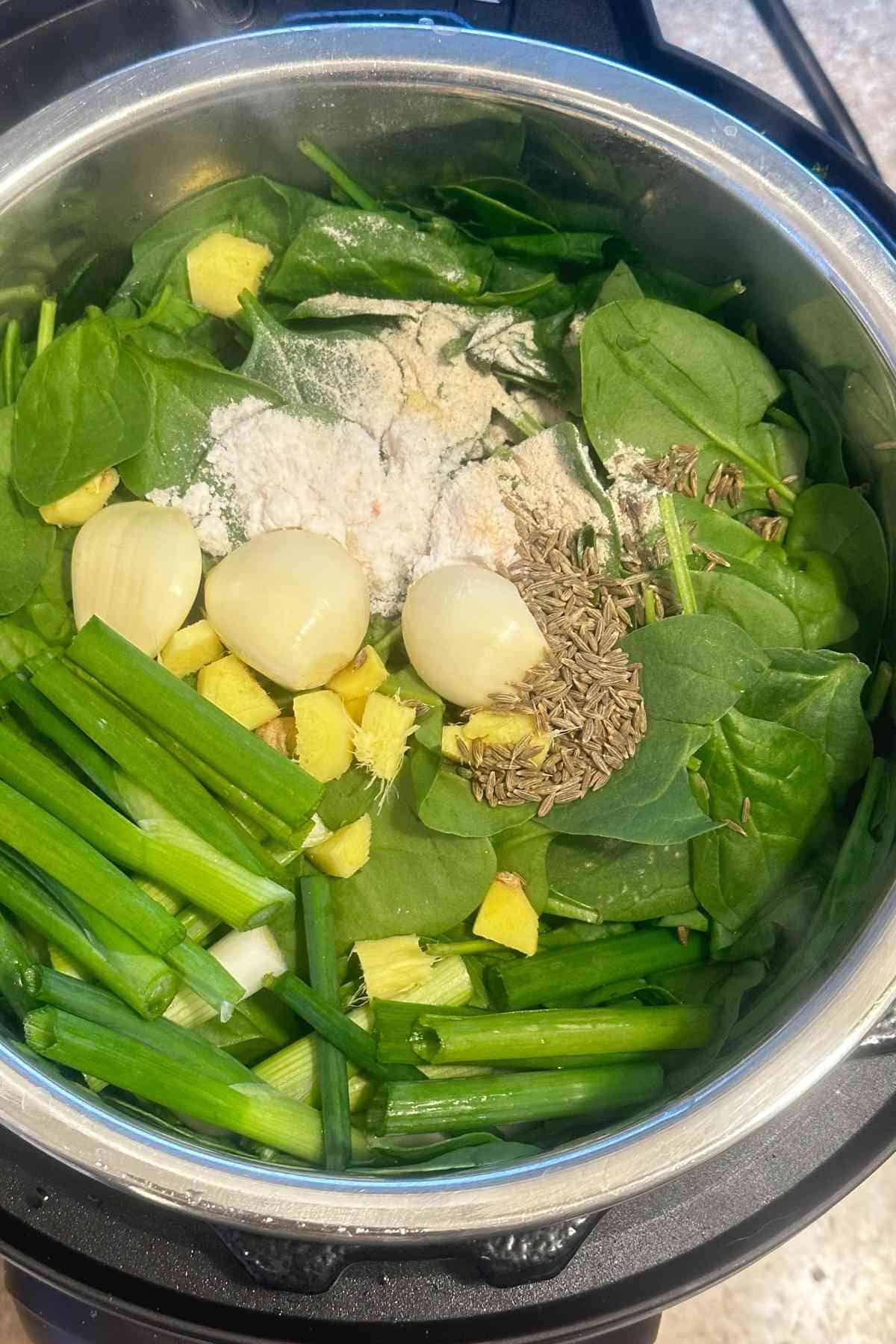 Fresh sarson saag & spices in the instant pot.