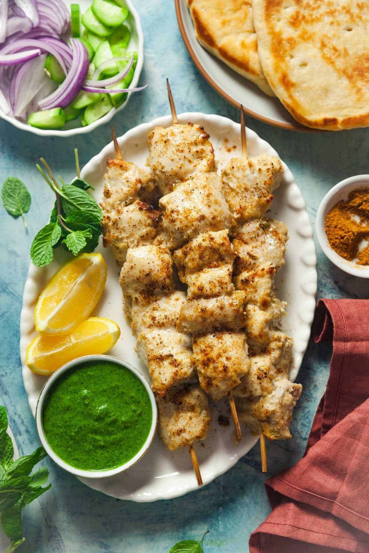 A platter consisting of chicken malai tikka.