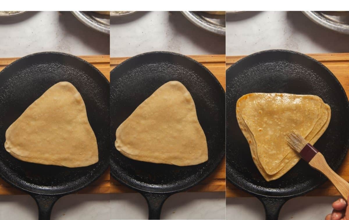 Frying triangle paratha on griddle