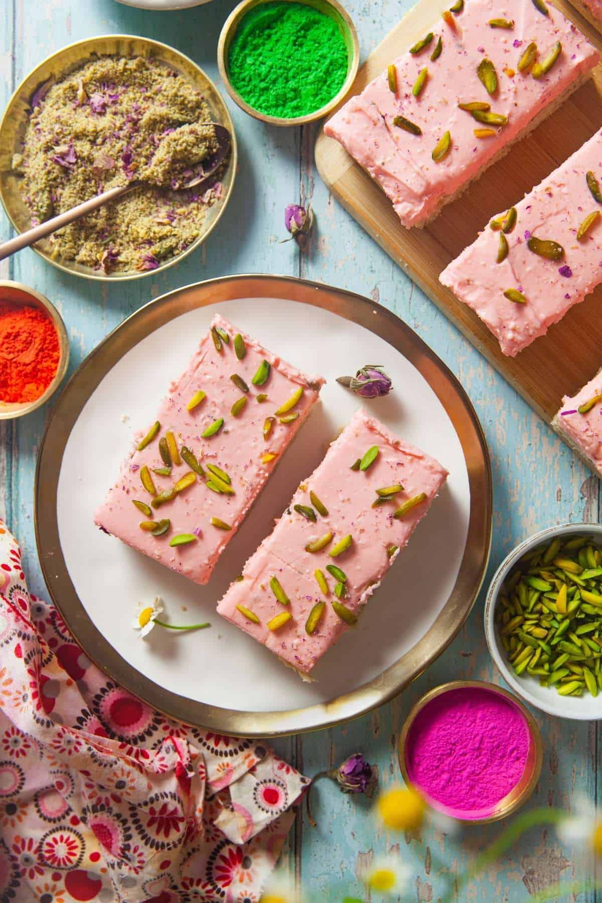 Rose Cheesecake Thandai Shortbread bars in a white & gold plate