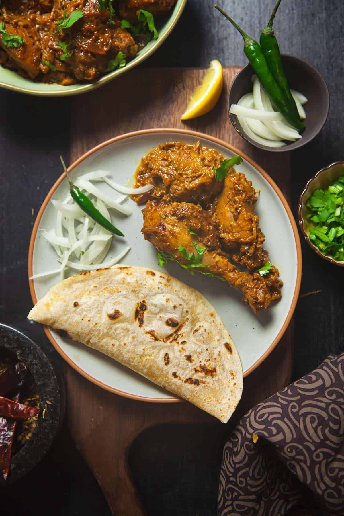 Dahi Chicken Served With Roti & Onions