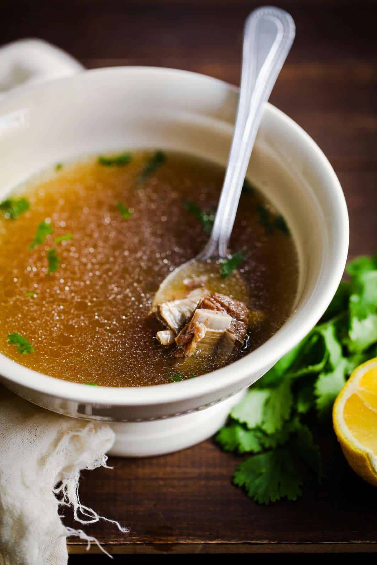 Warm Spiced Meat Broth in a bowl ready to be sipped.