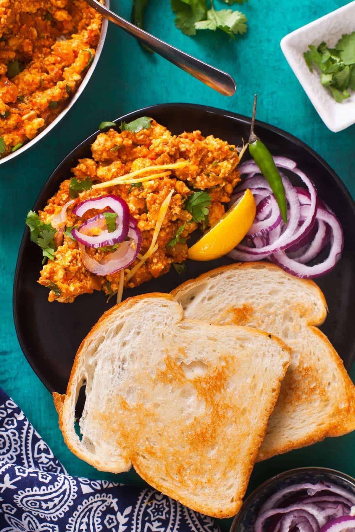 Scrambled Paneer With Crisped Bread & onions 