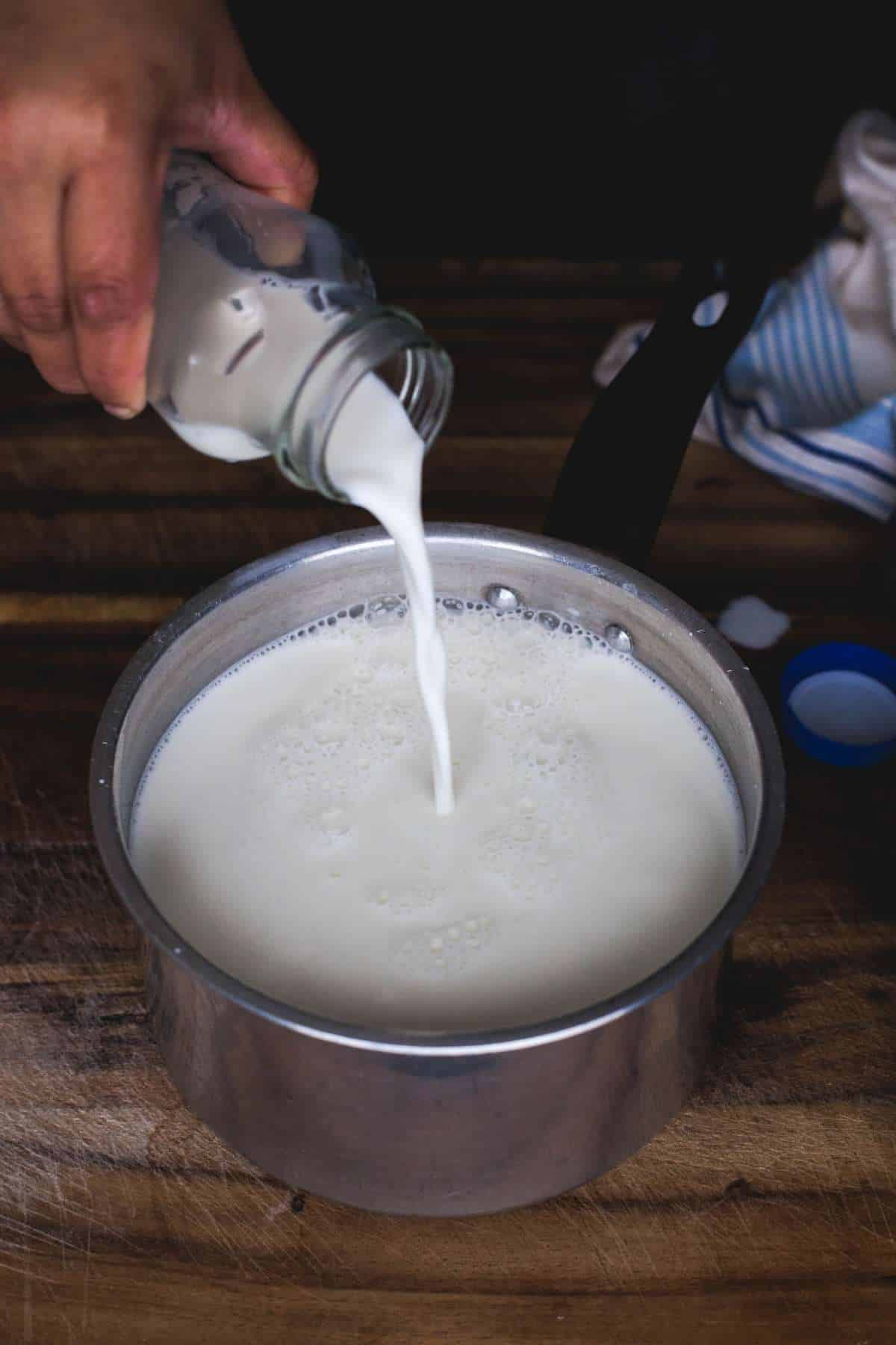 Pouring Milk into a pot 