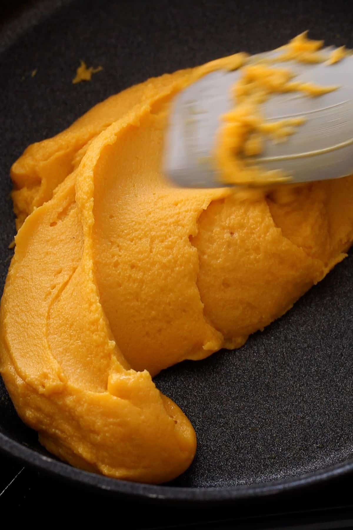 When the burfi mixture is ready it folds over itself.