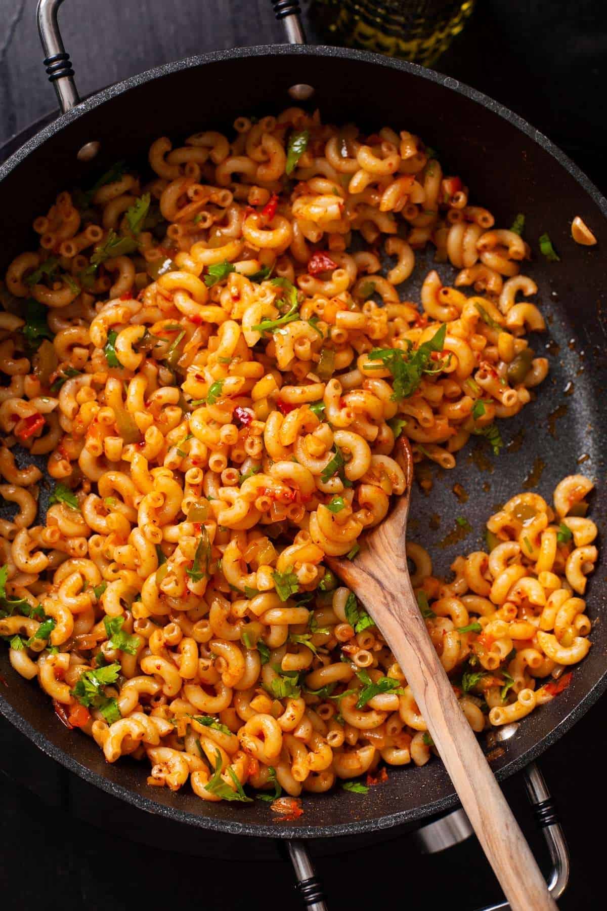 Spicy Indian Macaroni Pasta in a black pan. 