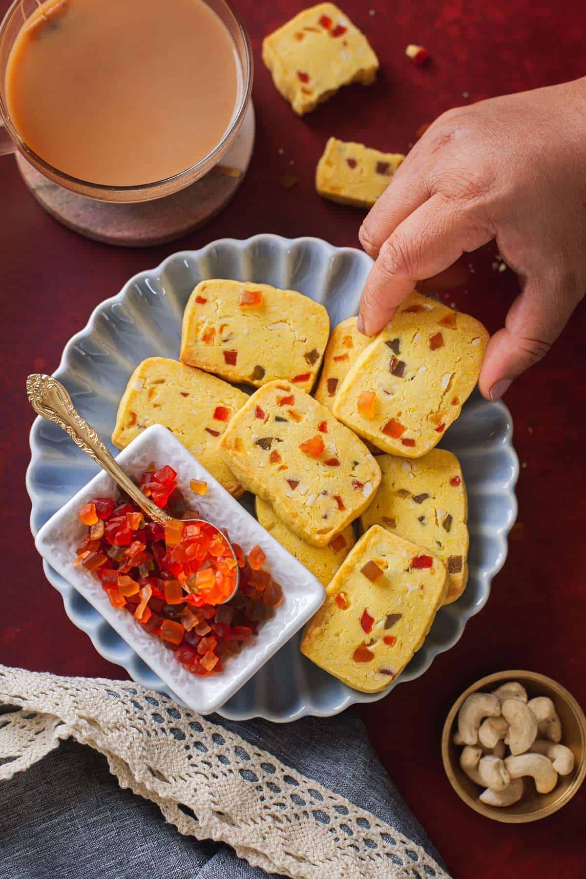 Tutti Frutti Biscuits in a plate on red background. 