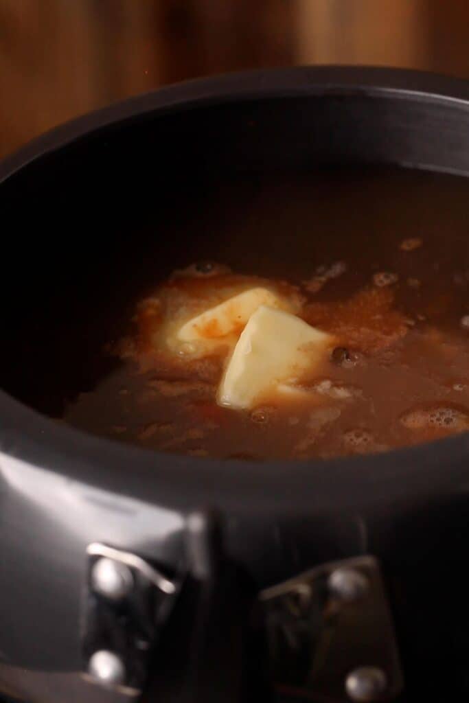 Butter added to dal before slow cooking.