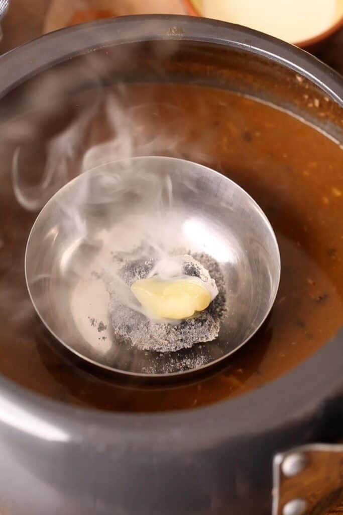 Smoking dal by using the dhungar technique in which ghee is added to hot charcoal.