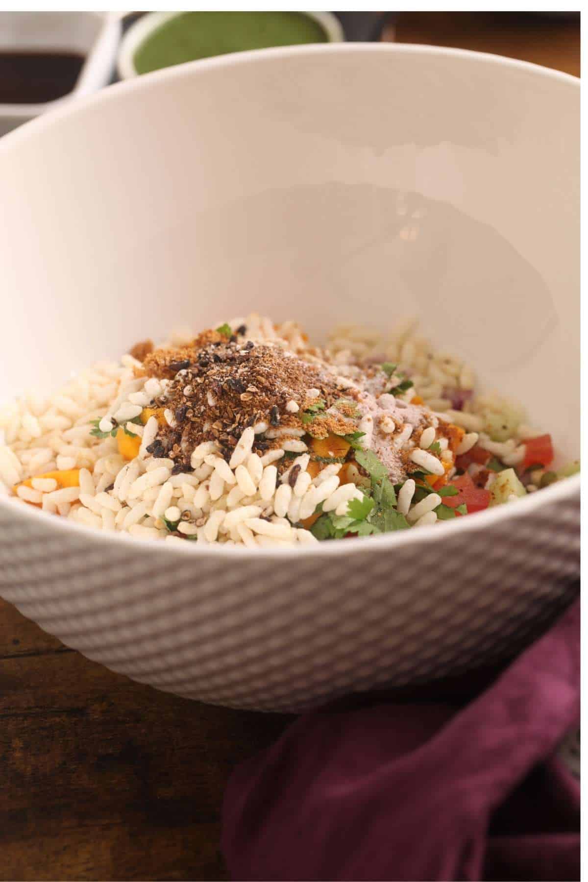 Powdered Chaat Spices on top of bhel.