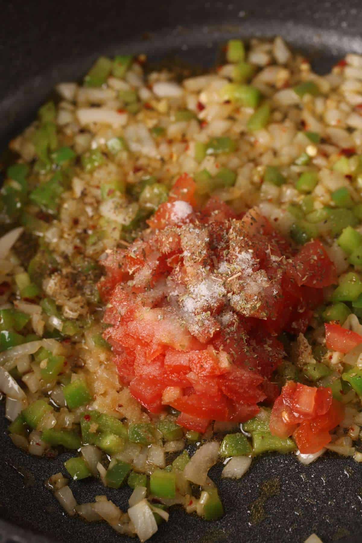 Fresh tomatoes and dried herb sauce for desi pasta.