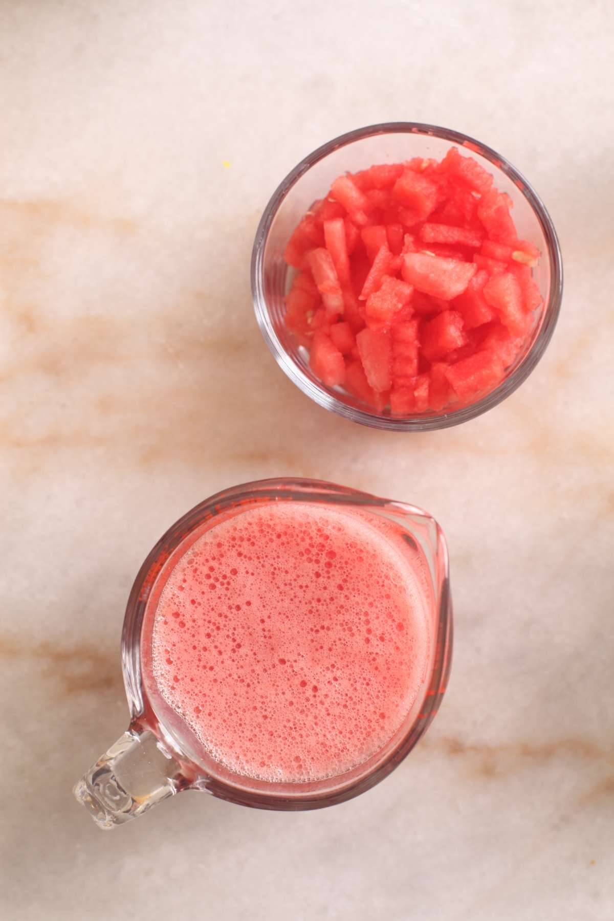 Fresh water melon Juice and cubed watermelon for making sharbat.