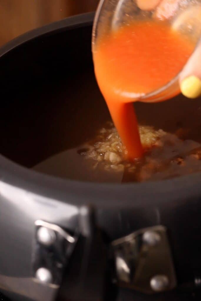 Add spices, tomatoes and ginger garlic to cooked dal.