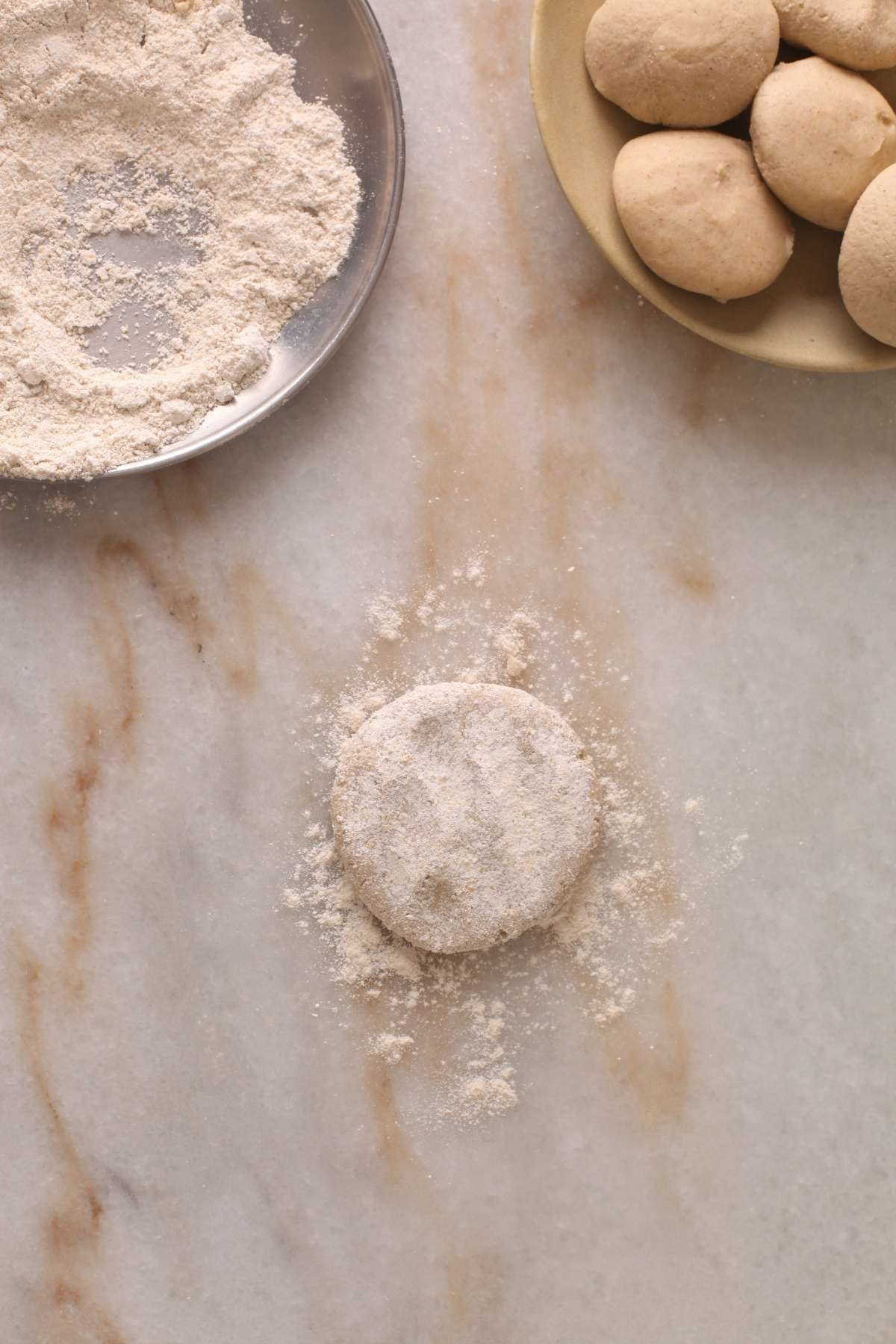 Sprinkle loose oats flour on each dough ball. 