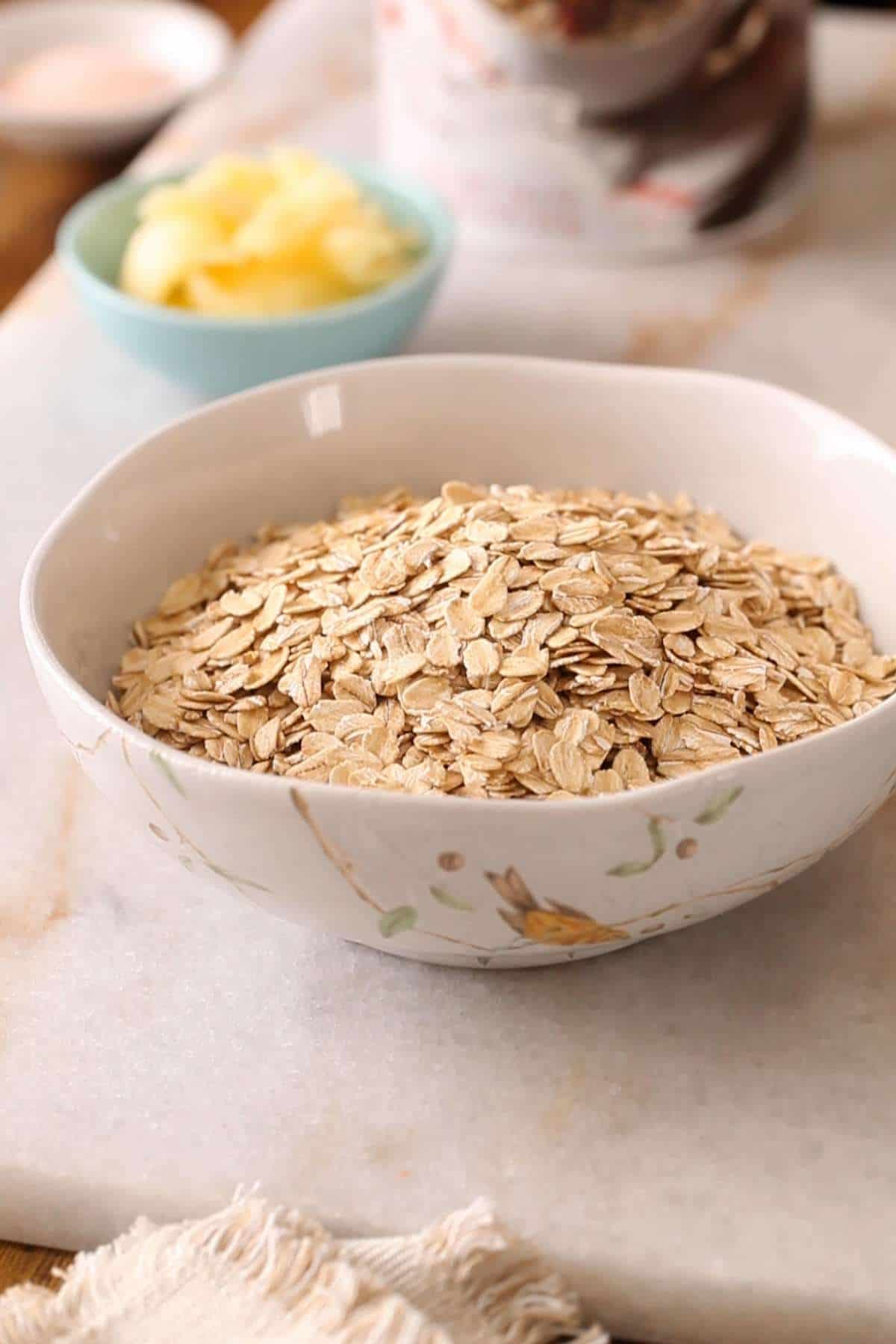 A white bowl with rolled oats.