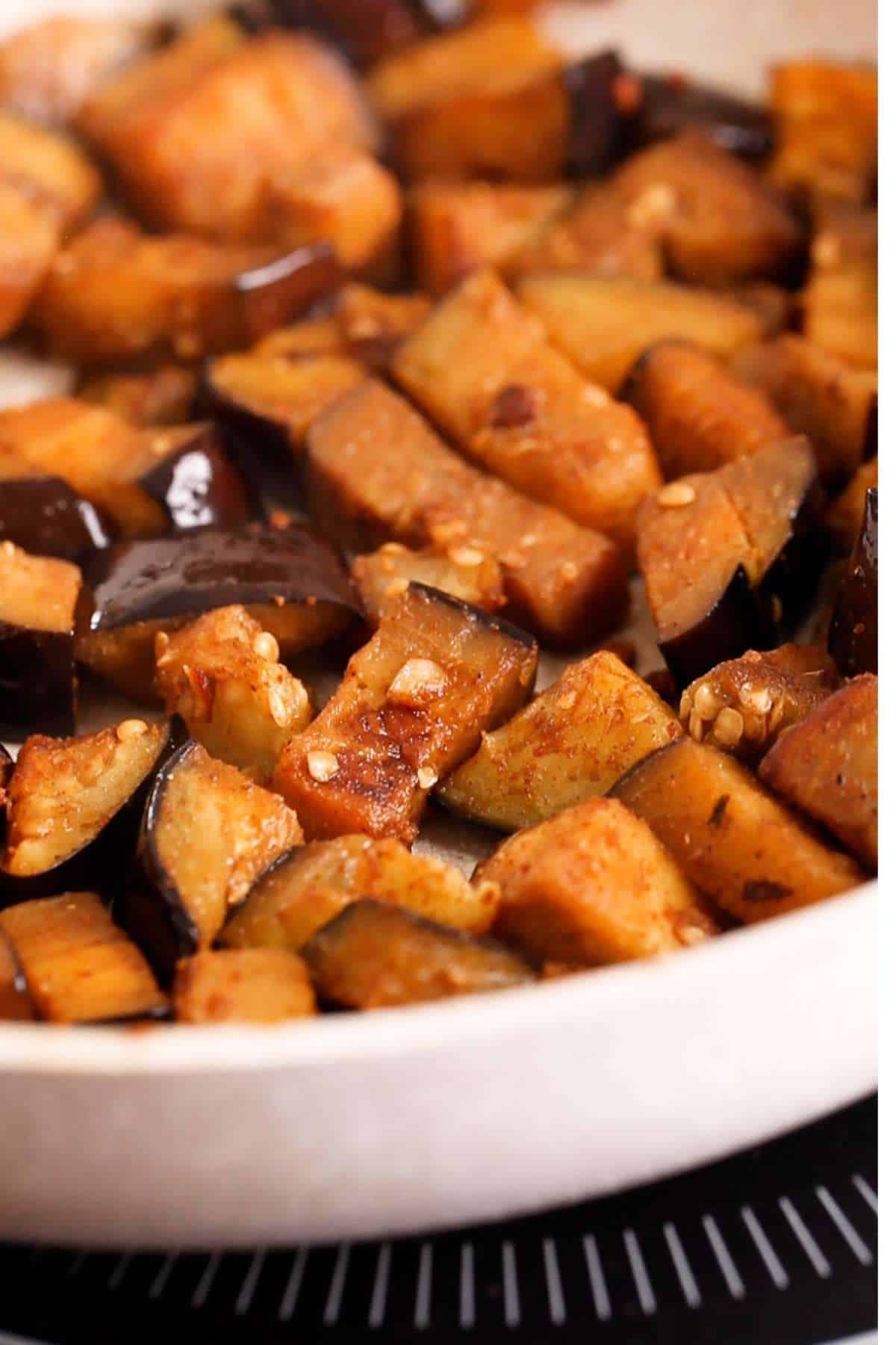 Pan fry the eggplant with spices.