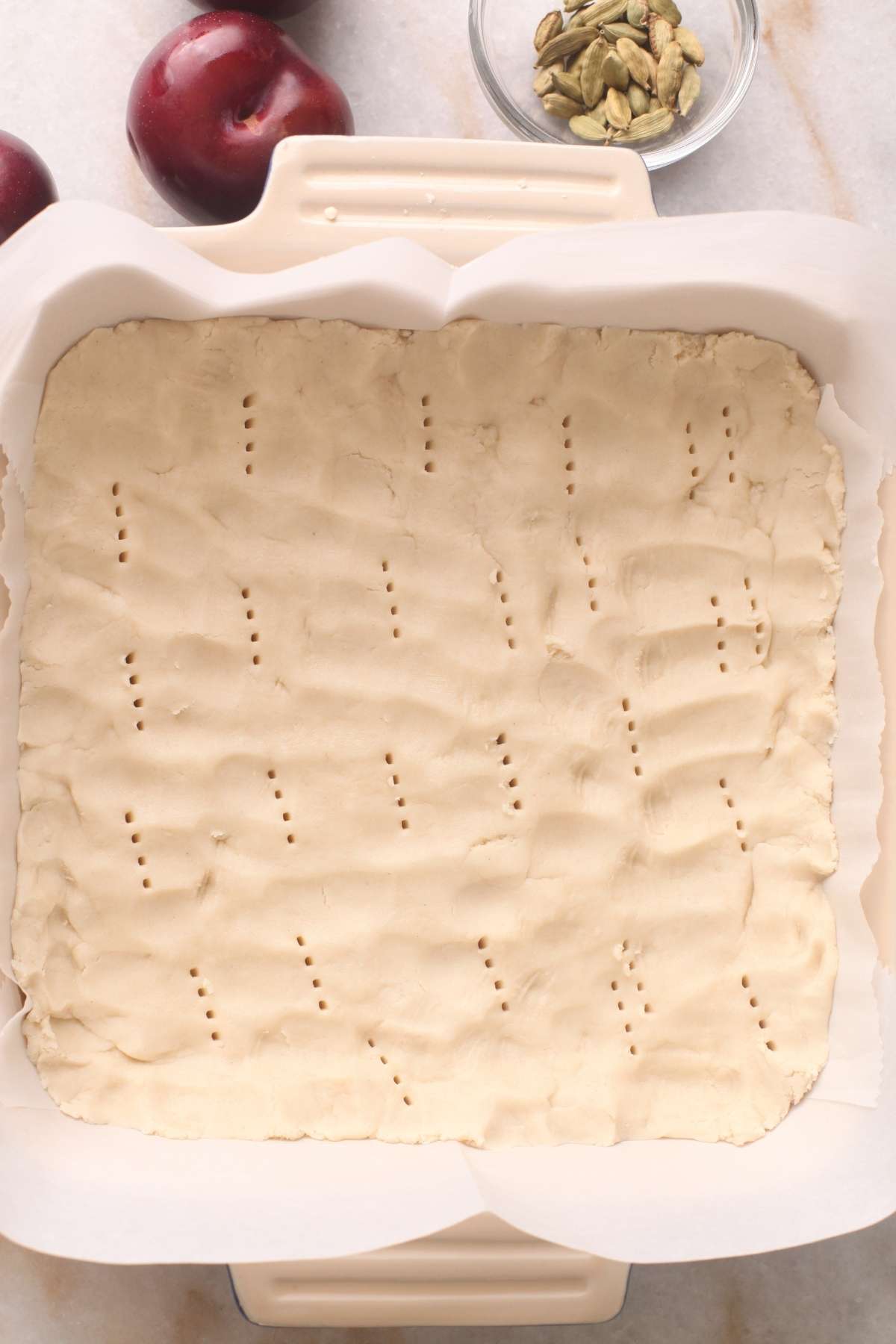 Shortbread Dough pressed down and pricked with fork before baking.