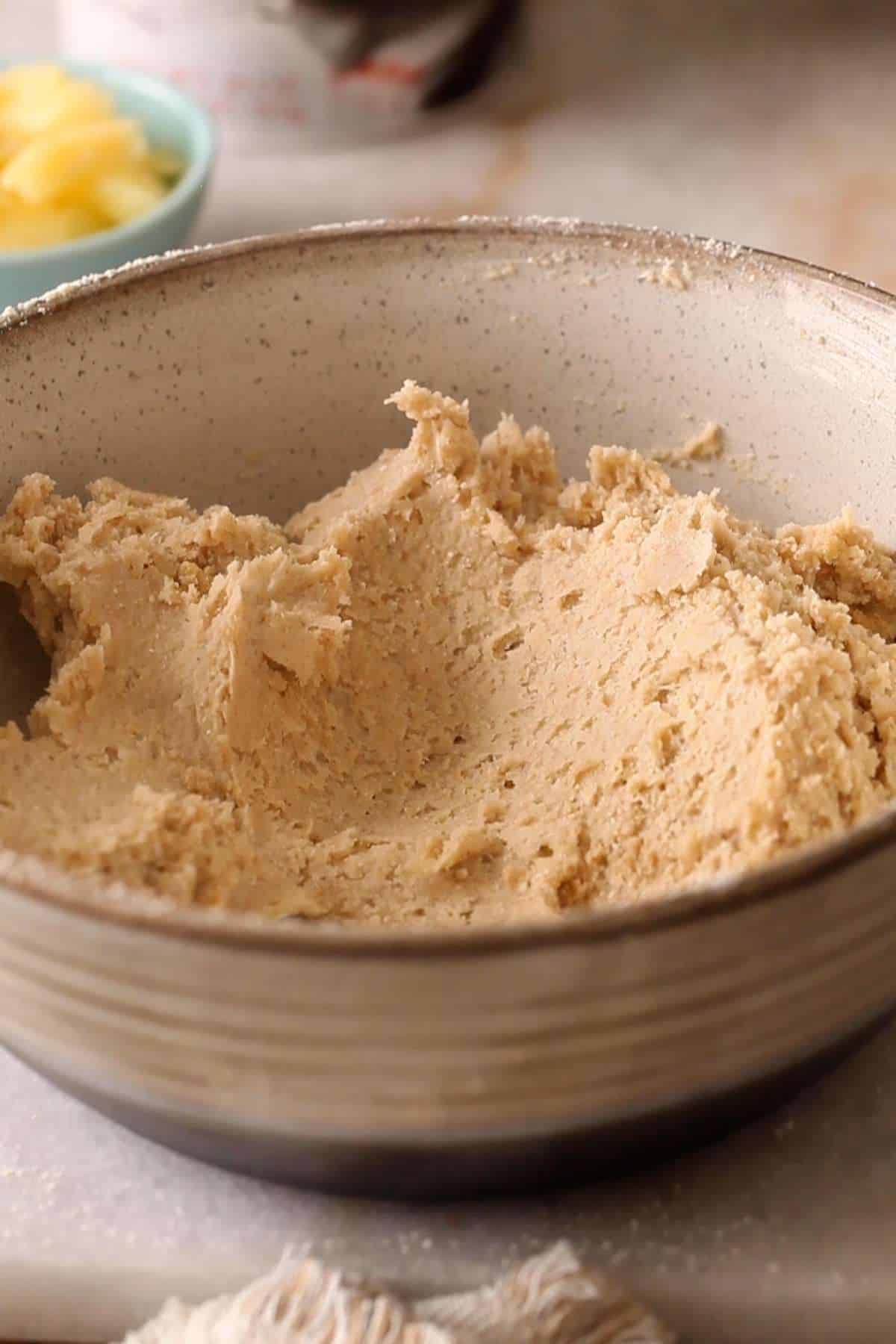 Mix the dough with a soft spatula to combine flours, salt, oil and hot water. 