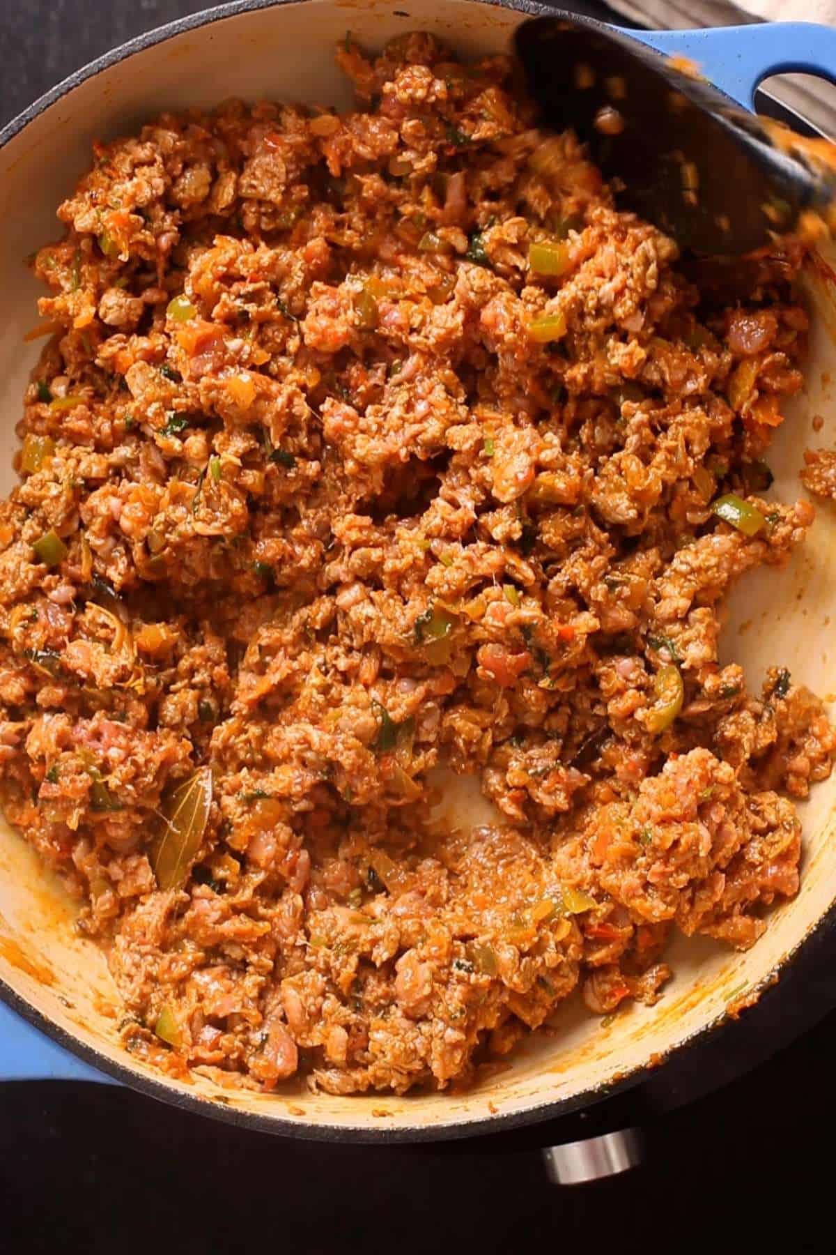 Browned keema in a braiser pot. 