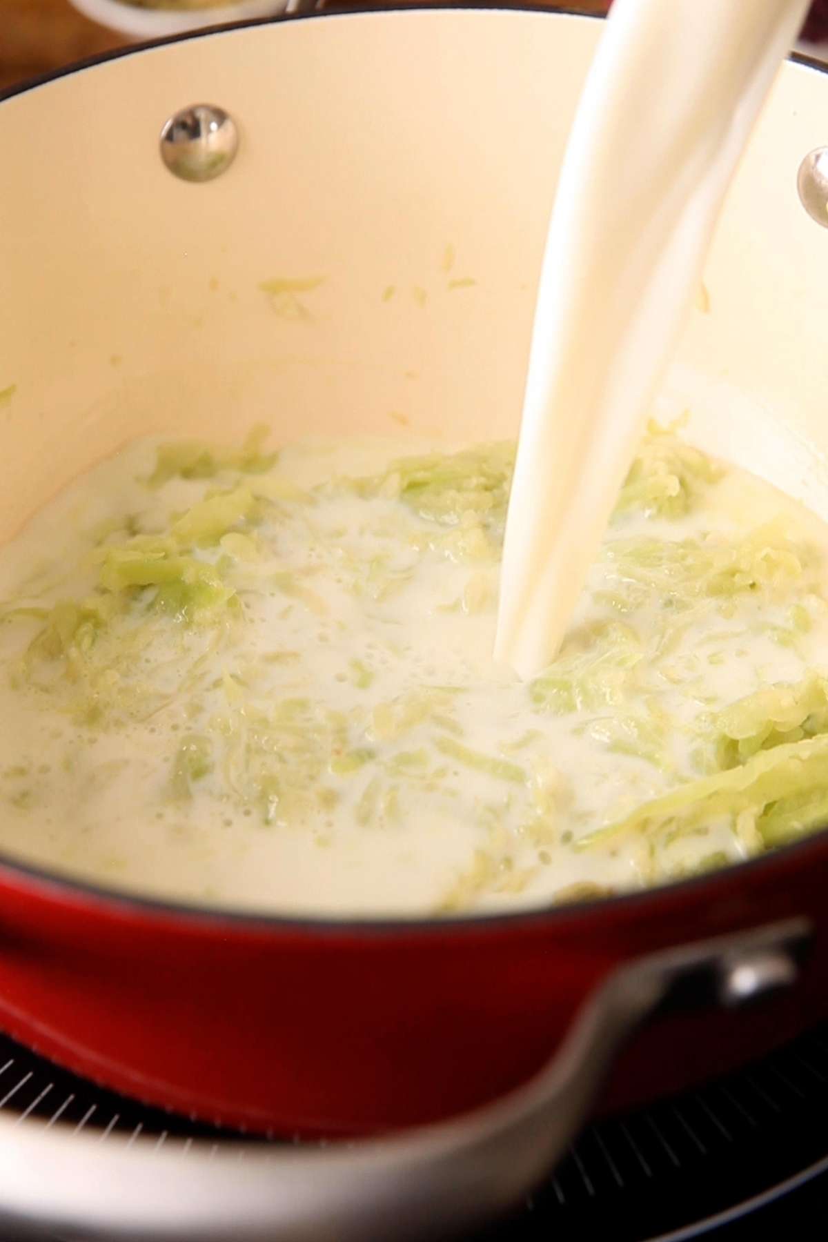 Milk added to sautéed lauki.