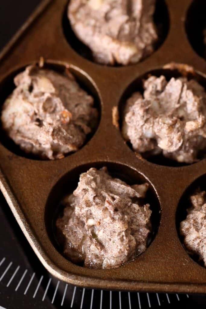 Add pakora batter to the aebleskievar pan.