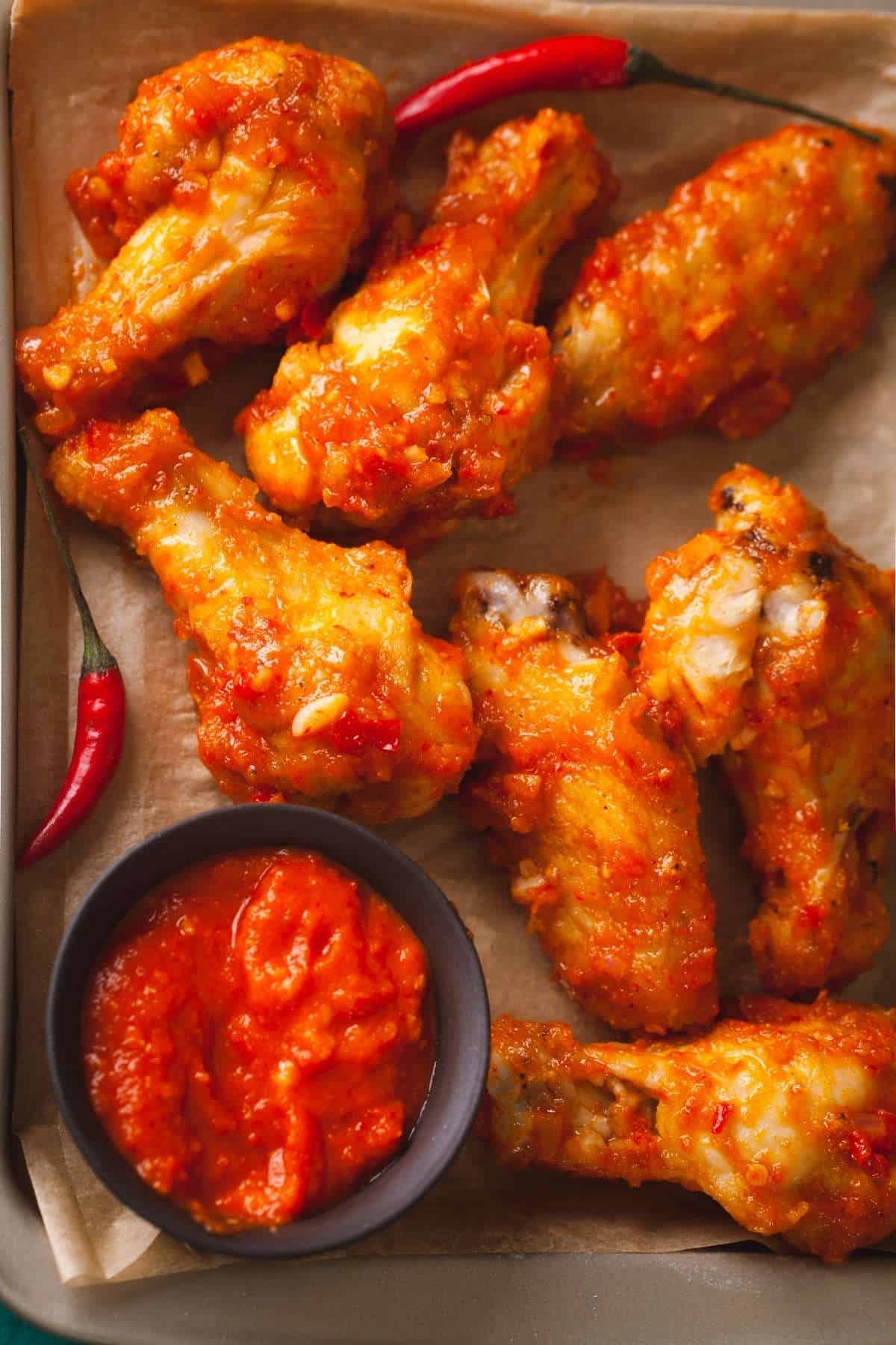 Spicy Garlic Wings on a parchment closeup shot.