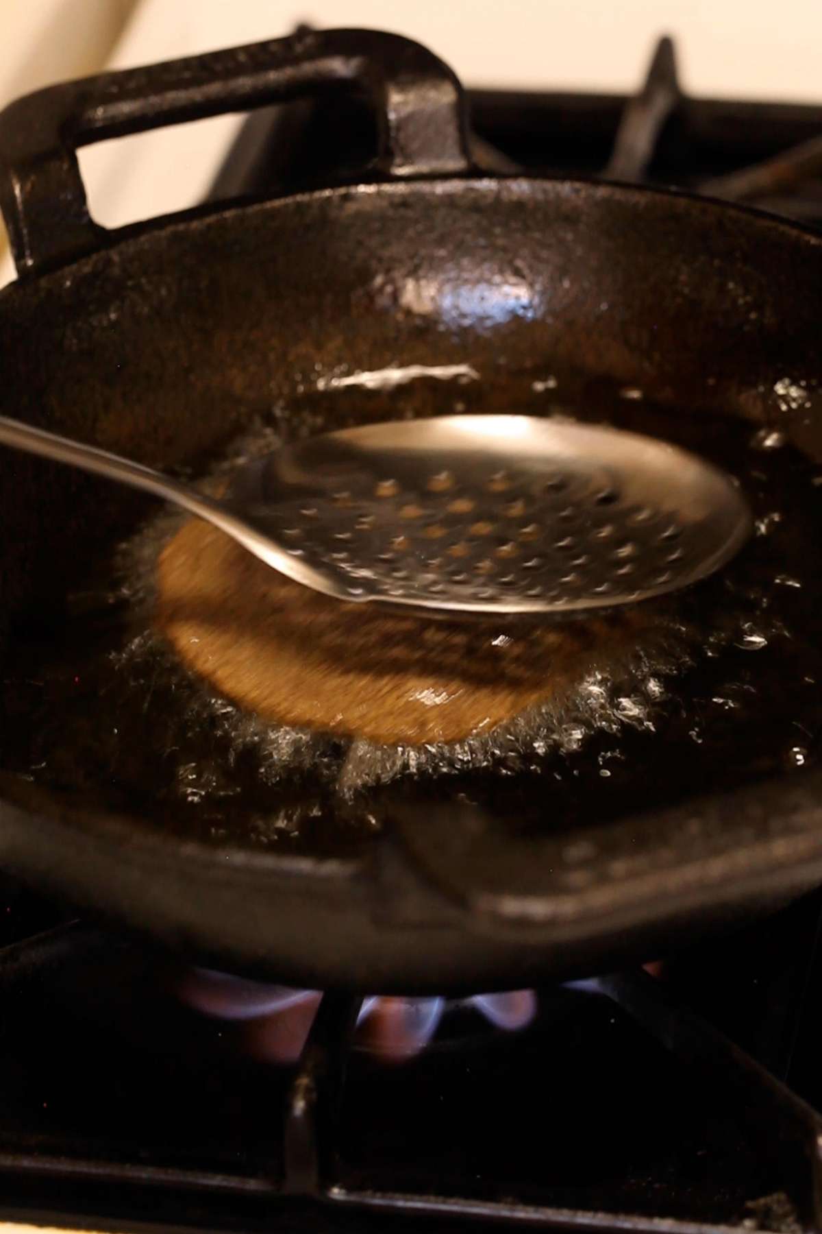 Deep frying kuttu pooris.