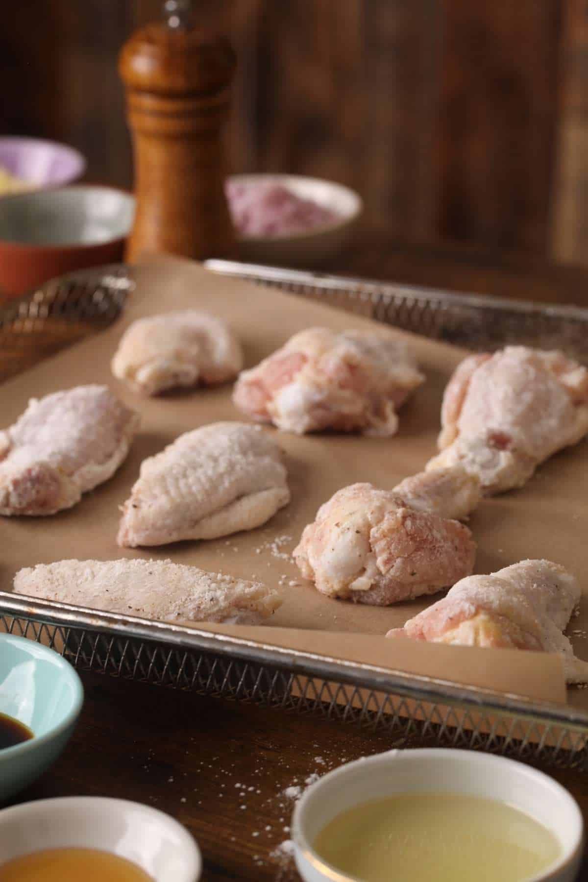 Raw chicken wings coated with seasonings ready tobe air fried.