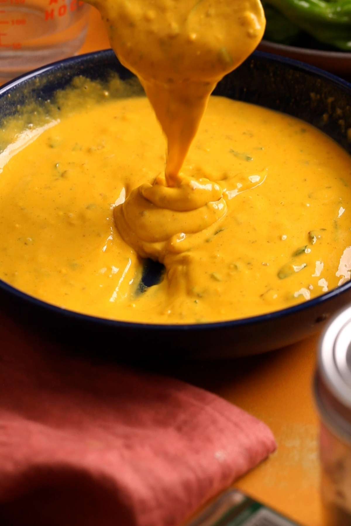 Pakora batter with ribbon like consistency.