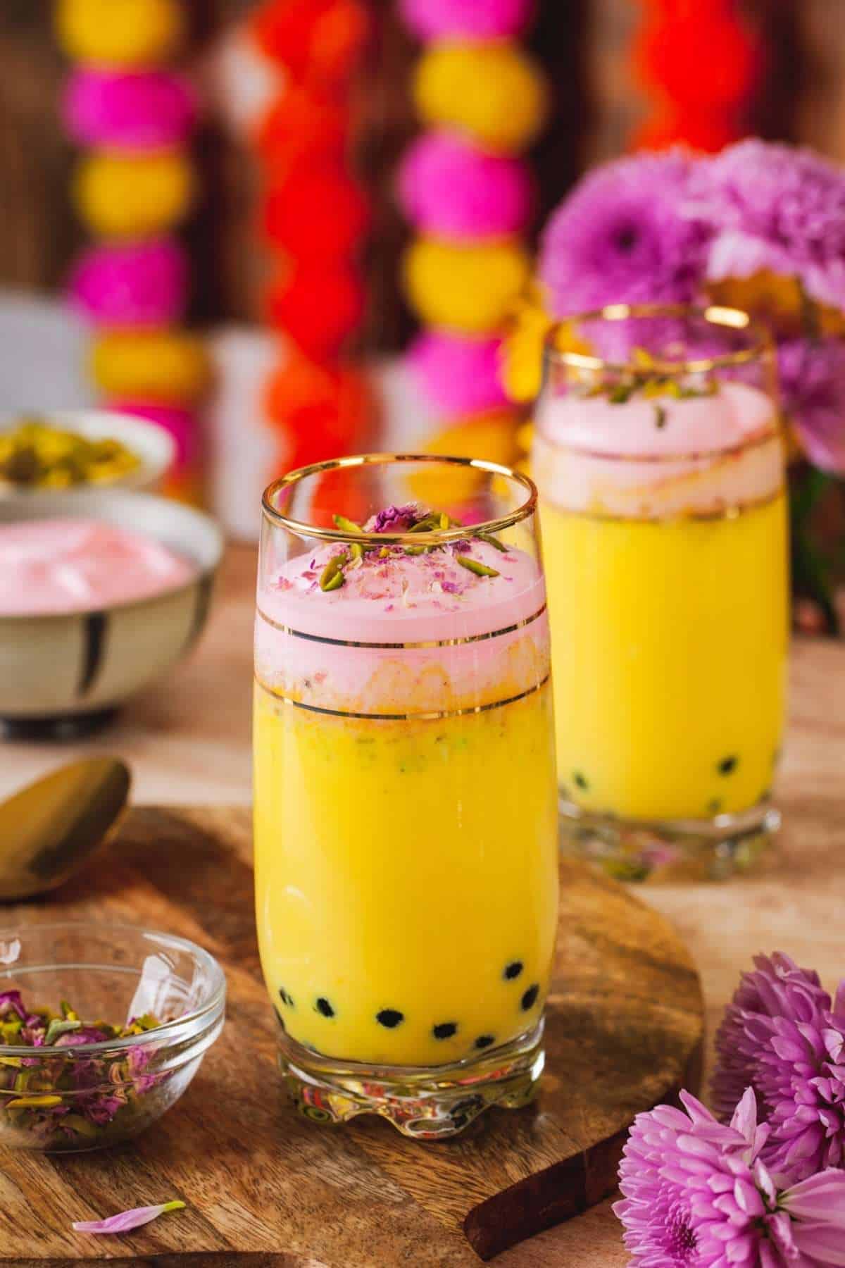 Rasmalai Milk Boba served in tall glasses with boba, milk and whipped cream.