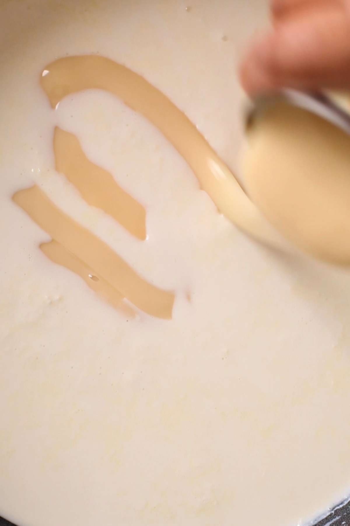 Adding condensed milk.