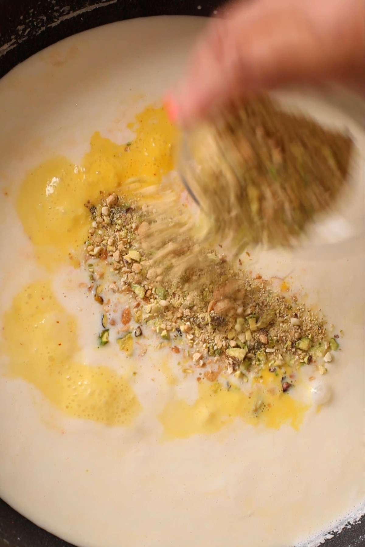 Nuts being added to rabdi.