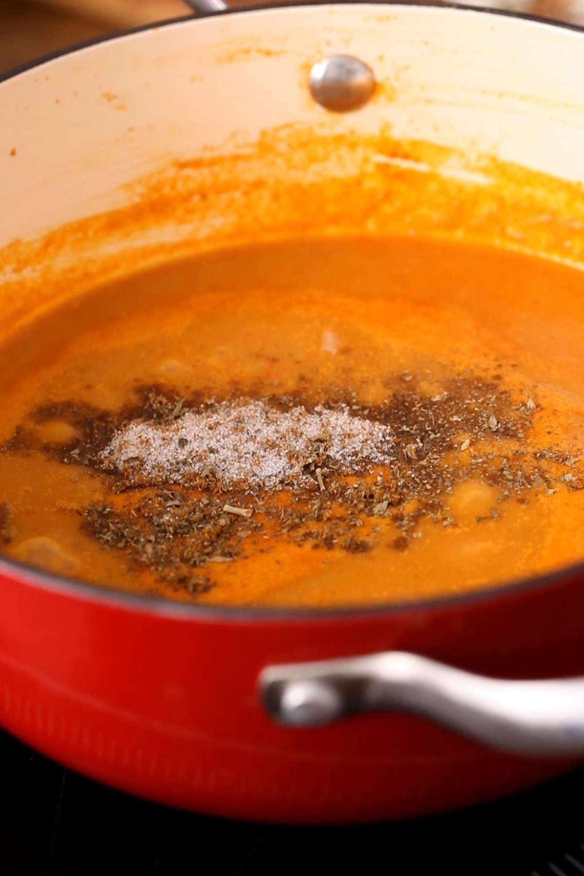 Add finishing spices to lababdar sauce.