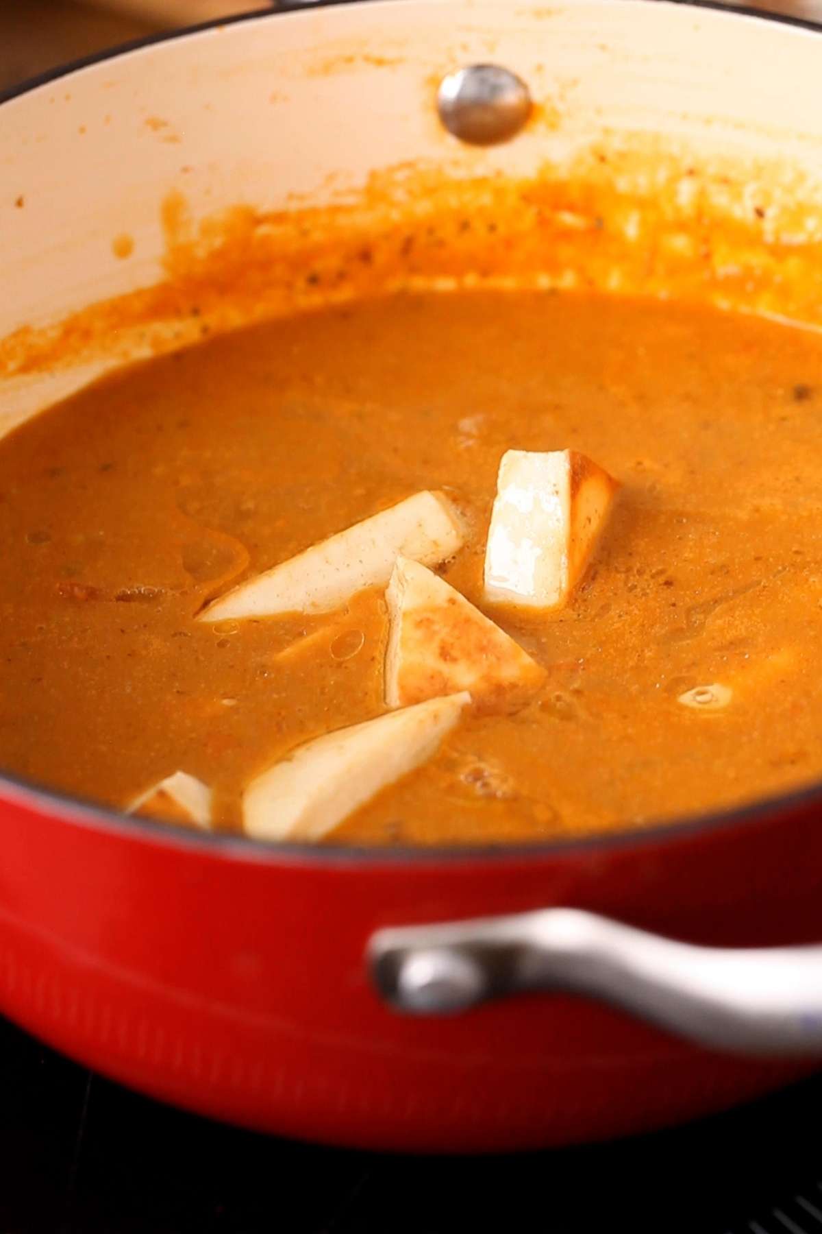 Add panfried paneer to the sauce.