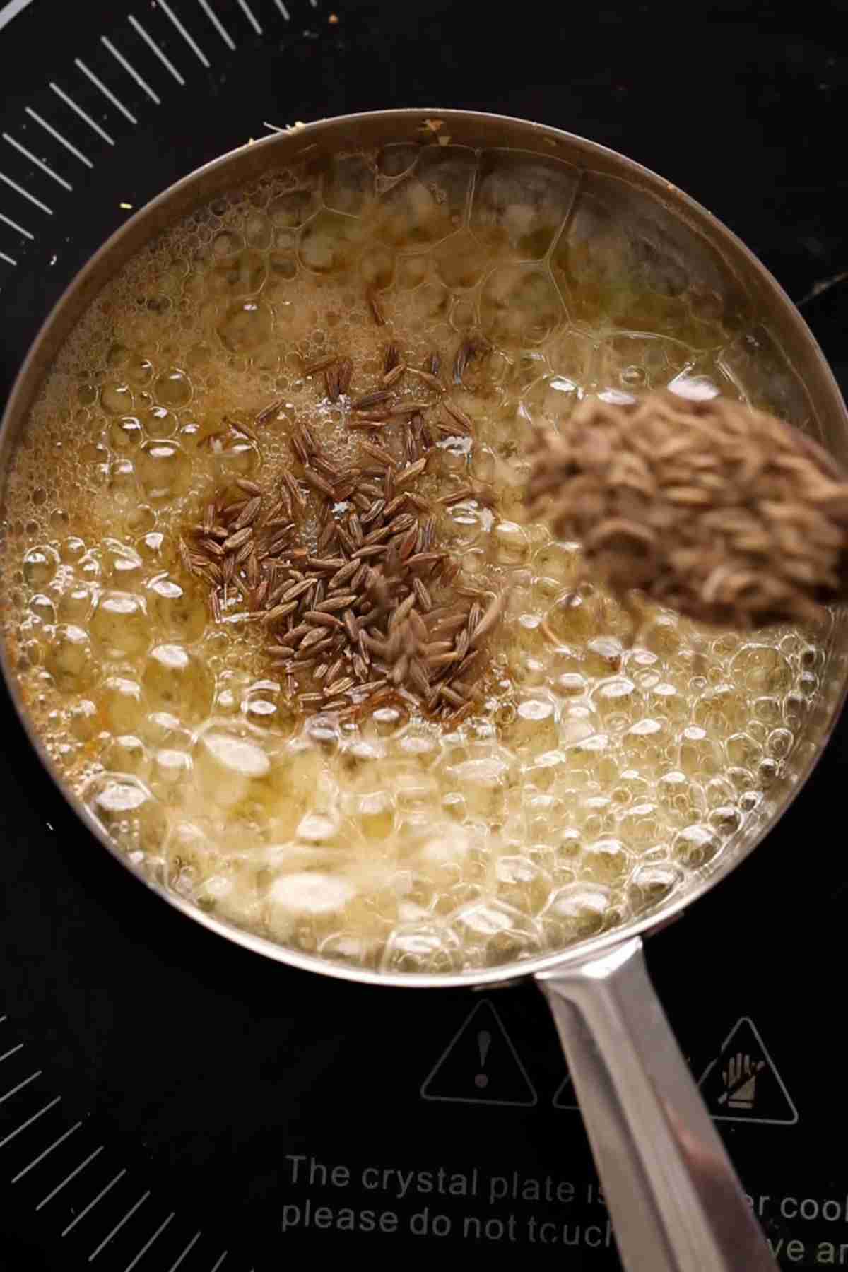 Make tempering with garlic, ginger and cumin seeds.