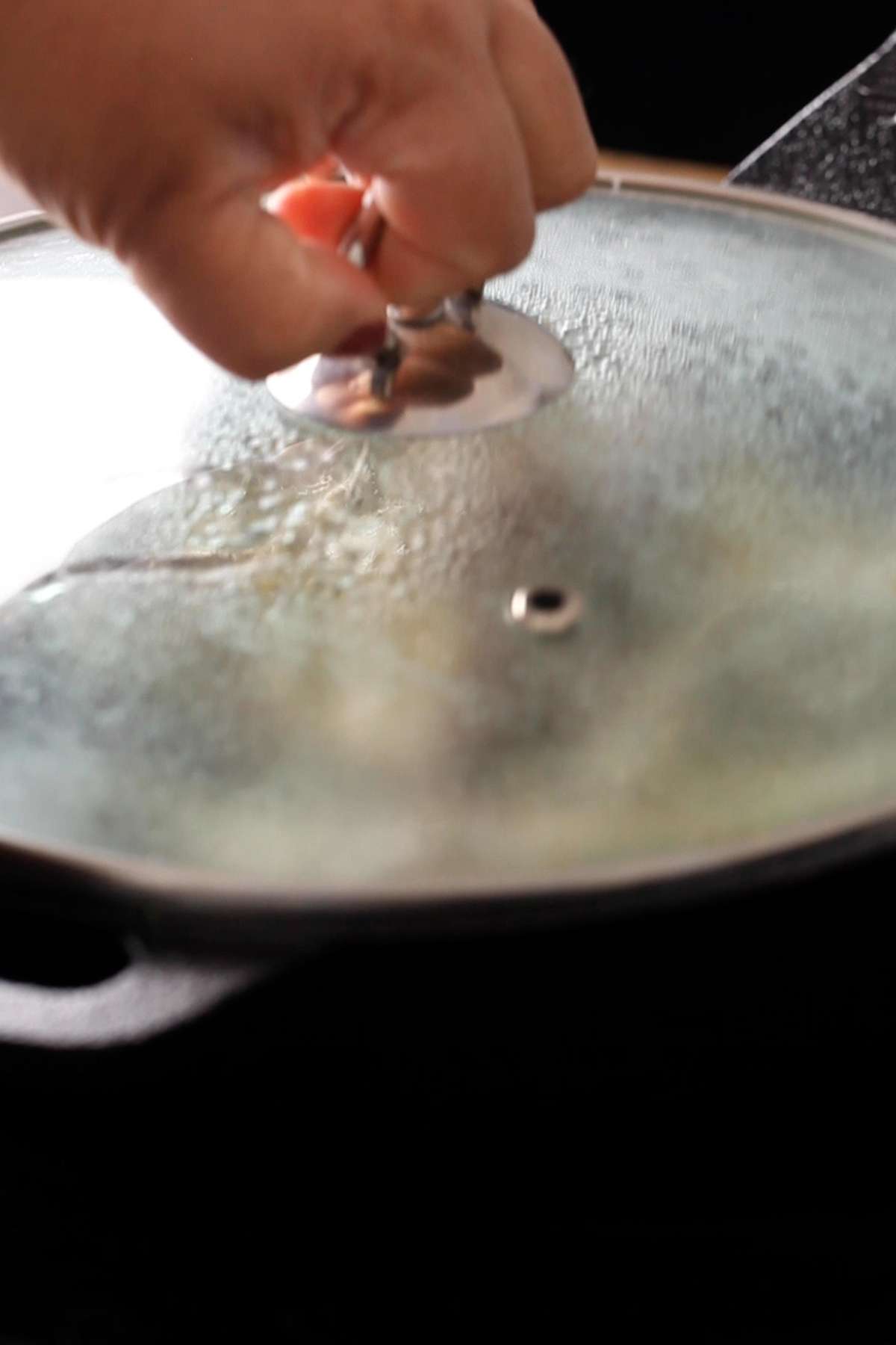 Cover and let chicken cook fully.