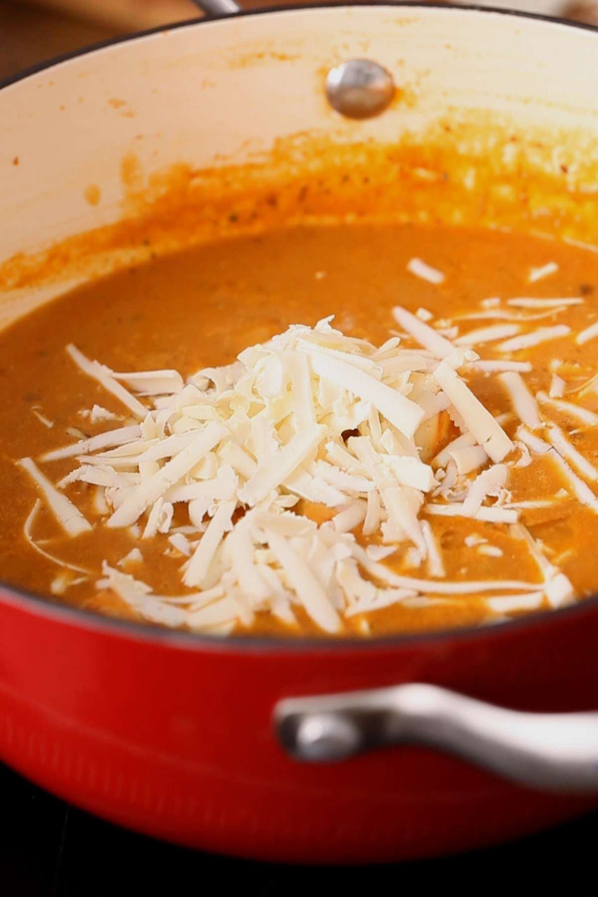 Add grated paneer to the sauce.