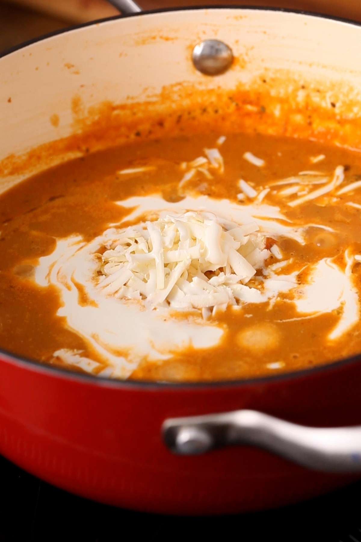 Add heavy cream to the finished sauce.