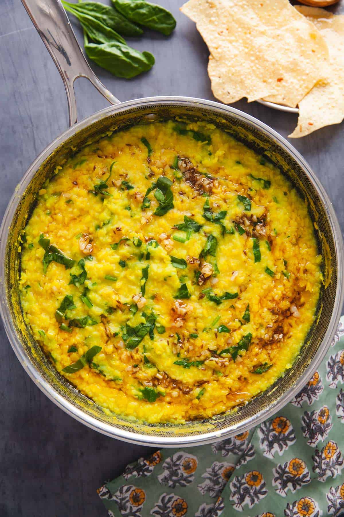Yellow Mung Dal Khichdi With Spinach in a pot.