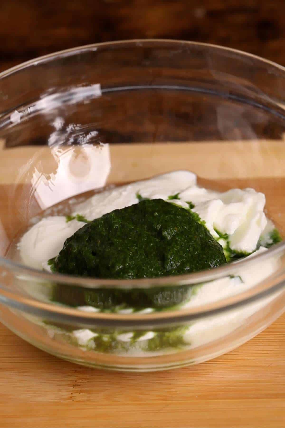 Add green chutney paste to yogurt. 