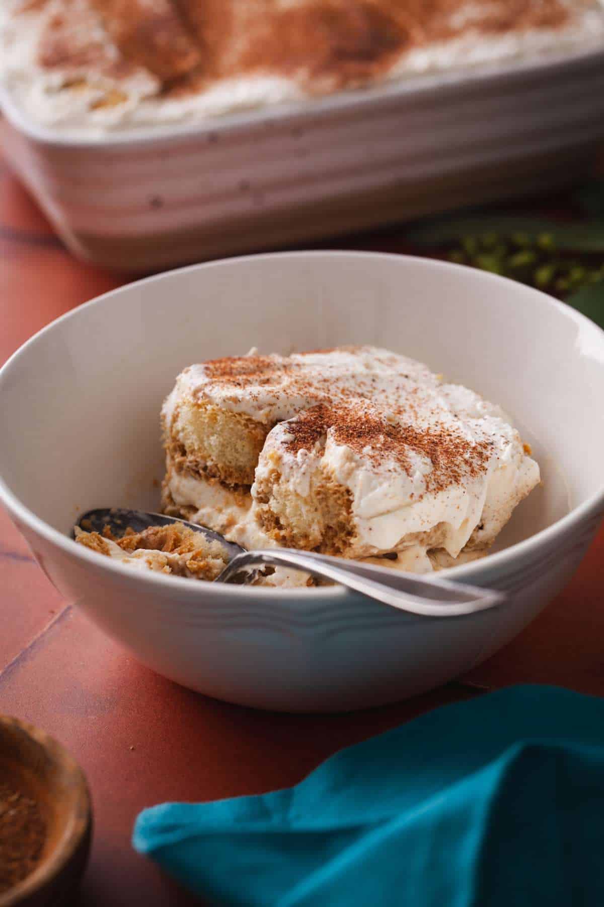 Side view of a sliced of tea tiramisu.