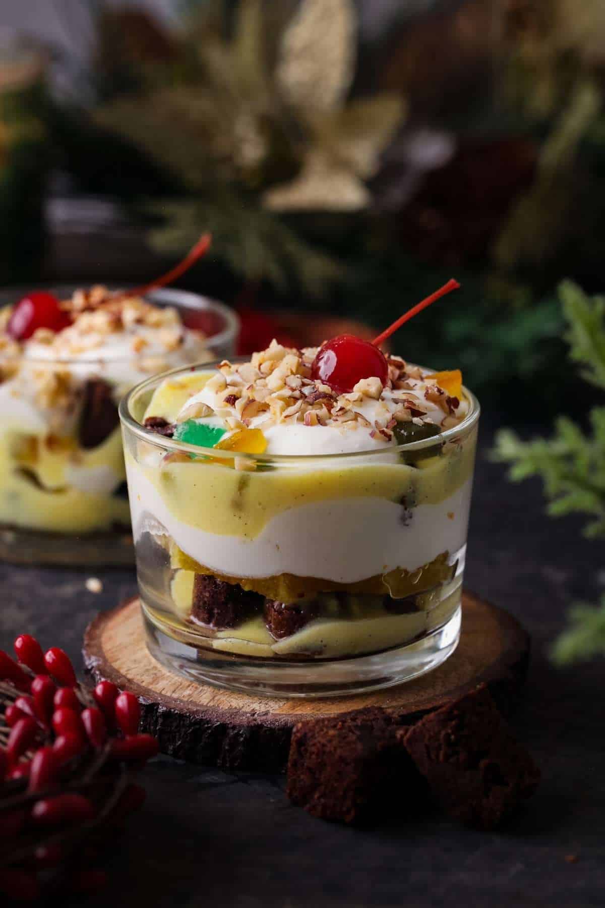 Brownie Trifles served in small dessert cups with holiday greenery and cherries. 