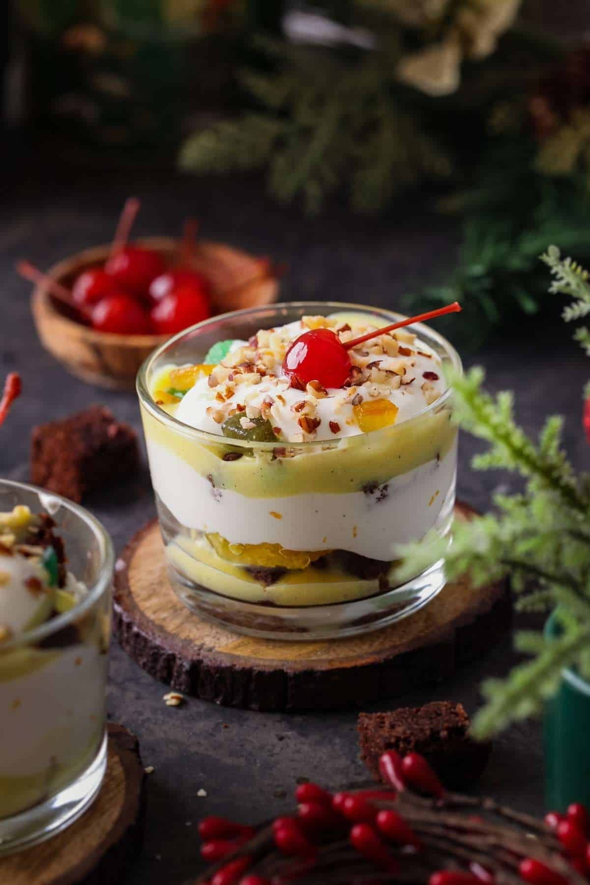 Individual serve brownie trifle with vanilla pudding and orange slices. 