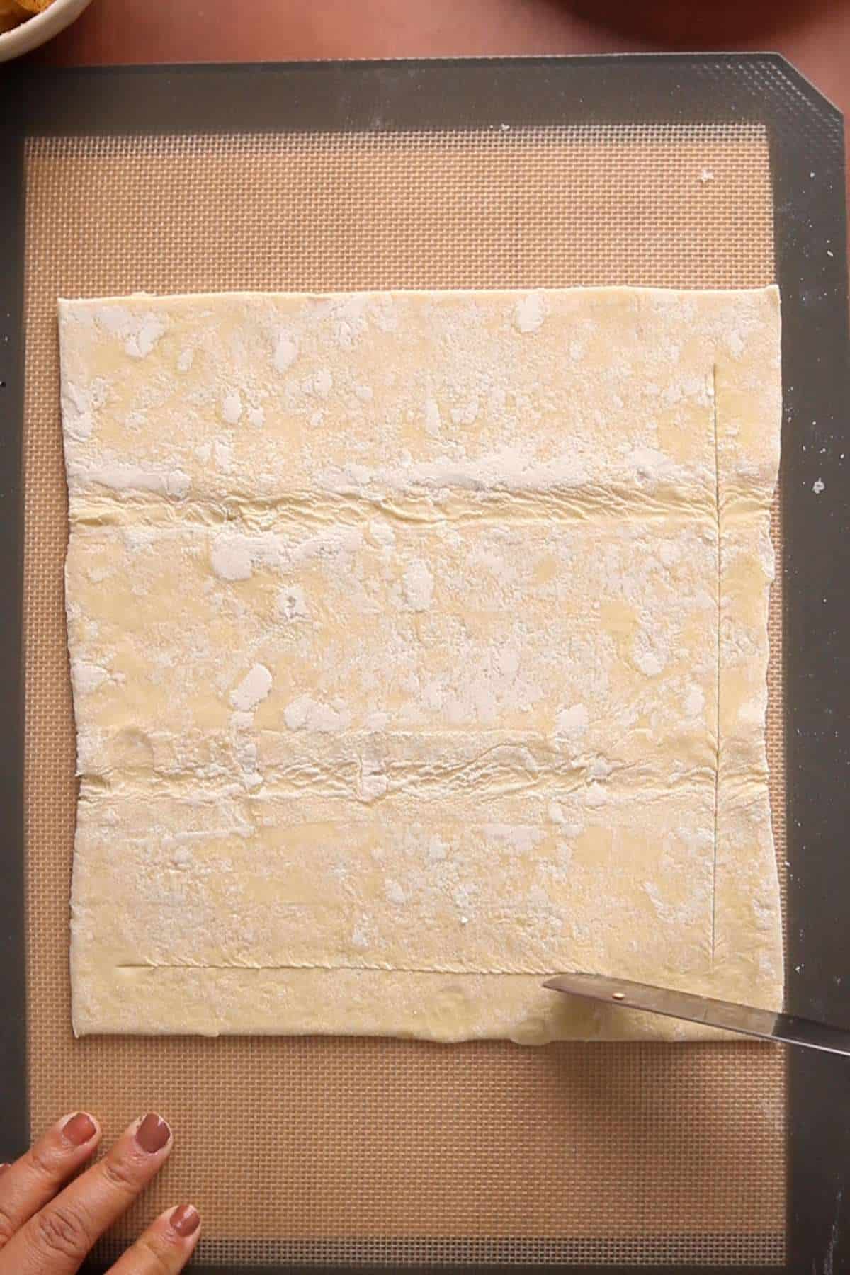 Getting Puff pastry ready for baking.